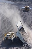 Mining Photo Stock Library - aerial photo of haul truck dumping overburden at dump site in open cut mine.  watrer cart sprying road in background for dust suppression. ( Weight: 1  New Image: NO)