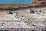 Mining Photo Stock Library - Drill rigs parked up next to blast hole patterns in open cut mine site.  aerial photo. ( Weight: 1  New Image: NO)