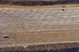 Mining Photo Stock Library - aerial photo of blast worker loading shot holes at open cut mine site.  hundreds of blast hole patterns all around. ( Weight: 1  New Image: NO)