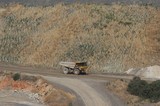 Mining Photo Stock Library - rahabilitation planting on hill in open cut mine.  Haul truck moiving alomng haul road in foreground. ( Weight: 1  New Image: NO)