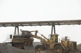 Mining Photo Stock Library - loader loading product into a crusher at shipping terminal.  overhead conveyor in background. ( Weight: 1  New Image: NO)