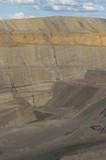 Mining Photo Stock Library - vertical photo of open cut coal mine.  great photo of high walls with a haul truck for scale to show the depth of the pit. ( Weight: 1  New Image: NO)
