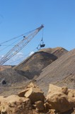 Mining Photo Stock Library - bucket of a dragline with deep blue sky behind.  shot from rock level at the ground.  portrait image. ( Weight: 1  New Image: NO)