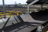 Mining Photo Stock Library - close up photo of a conveyor at coal terminal.  reclaimers, coal stockpiles and the port in background, ( Weight: 1  New Image: NO)
