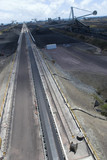 Mining Photo Stock Library - wide aerial shot of a coal terminal.  Reclaimers working coal stockpiles.  light vehicles on access road give scale. ( Weight: 1  New Image: NO)
