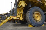 Mining Photo Stock Library - close up photo of new komatsu haul trucks parked at the go line in open cut coal mine. ( Weight: 1  New Image: NO)