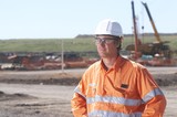 Mining Photo Stock Library - worker in full PPE looking across the camera near the workshop at a mine site. ( Weight: 1  New Image: NO)