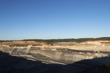 Mining Photo Stock Library - wide photo of open cut coal mine.  digger, haul trucks and machinery in operation.  high walls and coal seam. ( Weight: 1  New Image: NO)