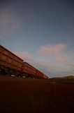 Mining Photo Stock Library - iron ore train moving through the Pilbarra at dawn. generic photo of heavy rail. ( Weight: 1  New Image: NO)