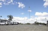 Mining Photo Stock Library - communications tower in the car park of remote mine site. light vehicles parked up.  generic photo showing site office buildings. ( Weight: 1  New Image: NO)