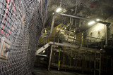 Mining Photo Stock Library - close up photo of underground wall mesh in under ground coal mine.  machinery in the background. ( Weight: 1  New Image: NO)