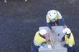 Mining Photo Stock Library - aerial photo of three mine site workers discussing work. ( Weight: 1  New Image: NO)