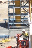 Mining Photo Stock Library - construction worker in full PPE including chest harness in EWP. ( Weight: 1  New Image: NO)