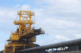 Mining Photo Stock Library - shiploader loading coal with conveyor up close.  stockpiles of coal in background. ( Weight: 1  New Image: NO)