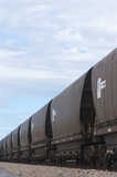 Mining Photo Stock Library - vertical photo close up of heavy rail carriages for coal. ( Weight: 1  New Image: NO)