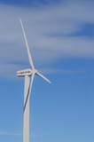 Mining Photo Stock Library - close up photo of large wind generator.  blue sky behind. ( Weight: 1  New Image: NO)