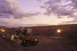 Mining Photo Stock Library - great dusk photo of a digger loading a haul truck at open cut mine site.  lights are on. ( Weight: 1  New Image: NO)